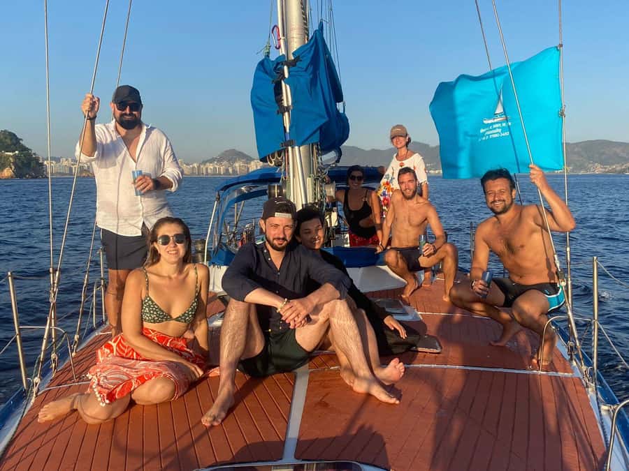 Rio de Janeiro: Sunset Sailboat Tour with Open Bar - Sunset landmarks and planes over the bay